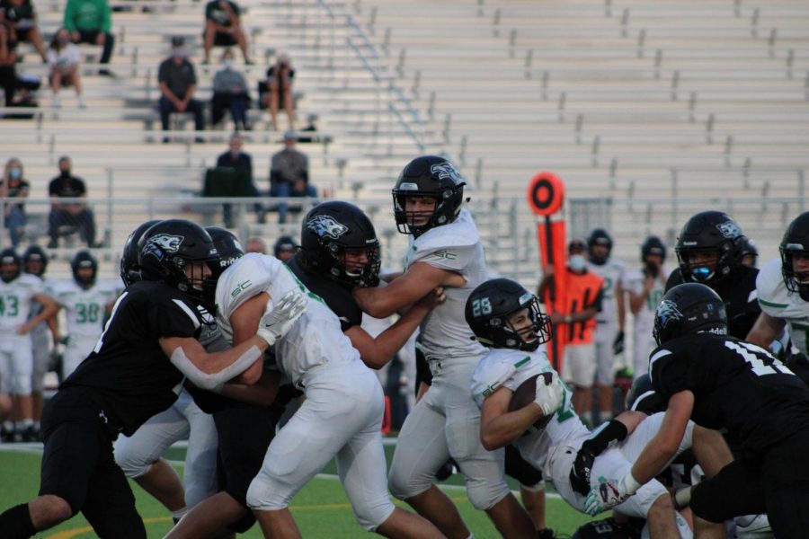 Elkhorn North's defense tackles Skutt's ball carrier.