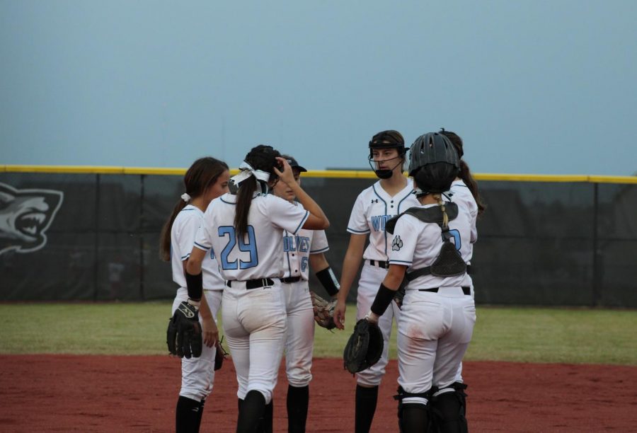 The North infield takes a quick meeting at the mound.
