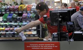 Student worker cleaning his register.