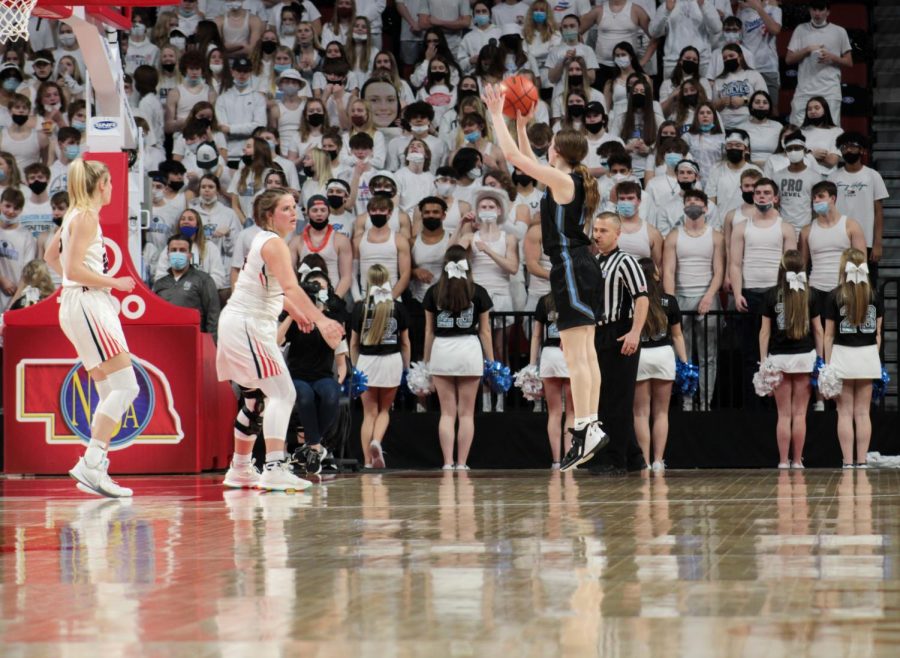 Grace Thompson going for a three pointer.