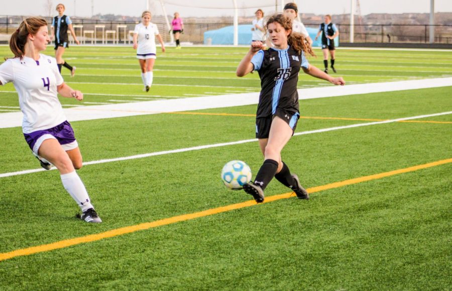 Ashley Philips saving the ball from going out of bounds.
