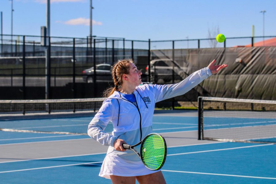 Paige Willcoxon, 11, serving the ball. 