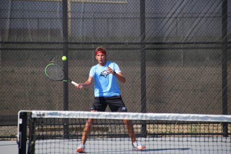 Ian Armbrust returning the serve