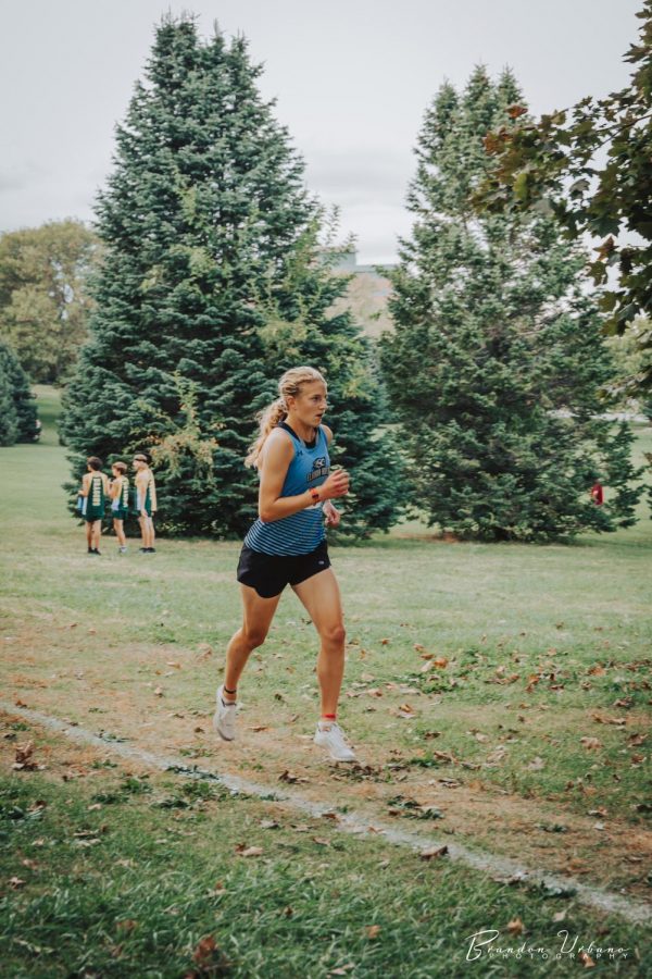 Sydney Stodden finishing a cross-country race earlier this fall.