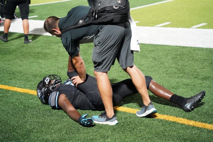 Nadrchal stretching out Kyree during the game. 
