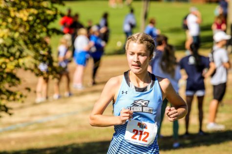 Ella Ford running in state cross country on October 23, 2021. Ford seeing the end of her top fourteenth finish at state.
