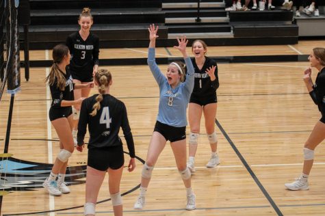 Haylee Wolf at the state volleyball game on November 4, 2021. Wolf is celebrating with her team after they win a set. (Photo by Tara Binte Sharil)