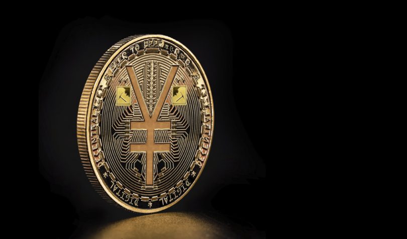 A+coin+depicting+the+symbol+of+China%E2%80%99s+Yuan+%28ledgerinsights.com%29.