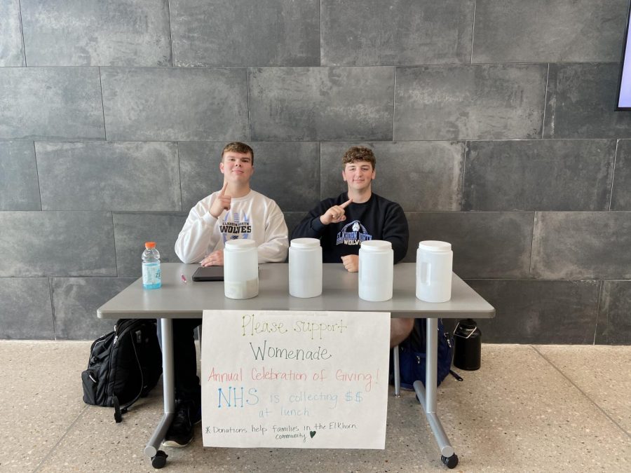 Dominick Rhone and Mitchell Baker collecting money during lunch for Womenade.