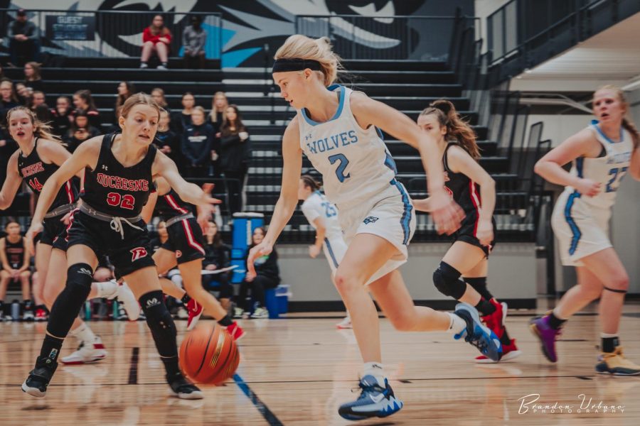 Britt Prince attempting to beat her opponent to the ball. 