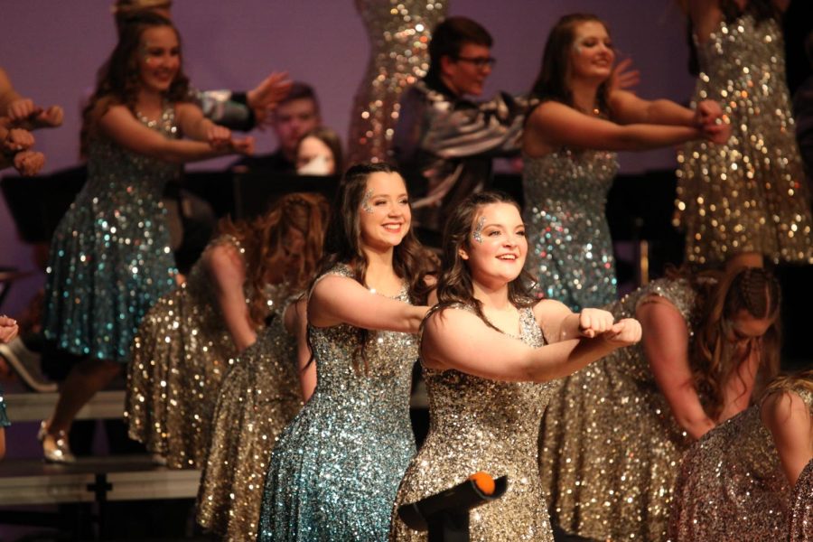 Skye Steiger singing alongside Abby Kline using their elegant movements to take Elkhorn North to a 4th place finish.  