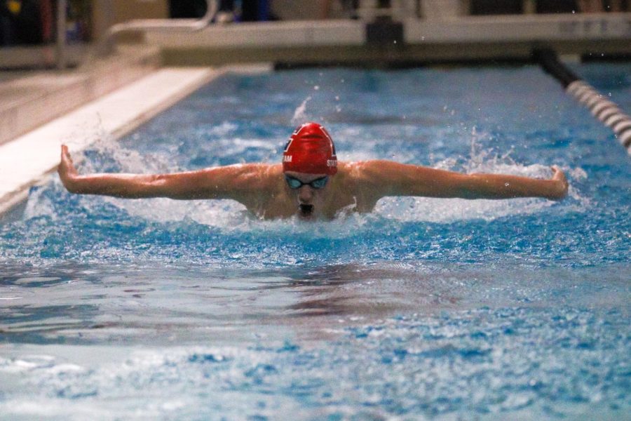 Dawson Thomsen midway through the butterfly during the 100 yard butterfly.  