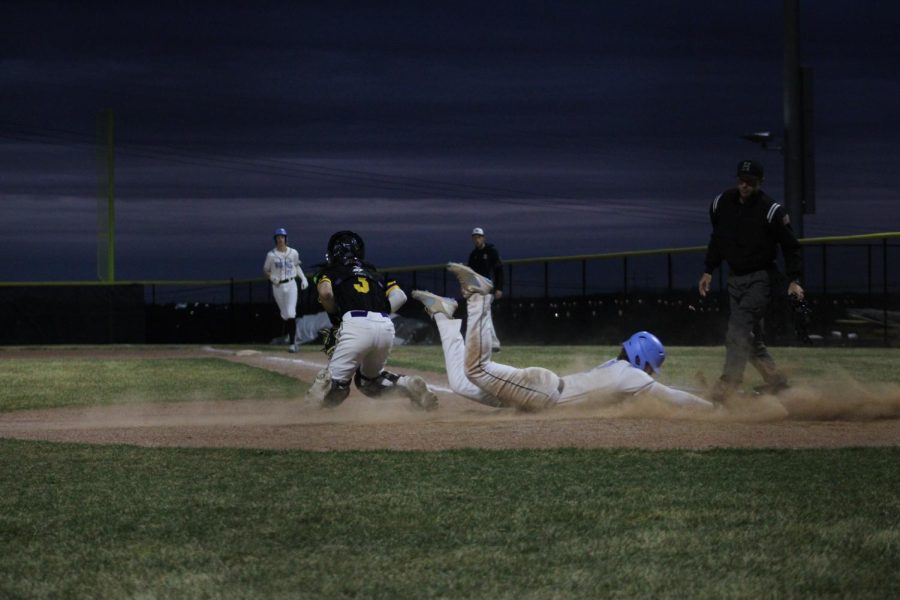 Tyson Fancher makes an aggressive base running play scoring from second on a ground ball. When asked why he slid Fancher responded, I needed to get my uniform dirty.