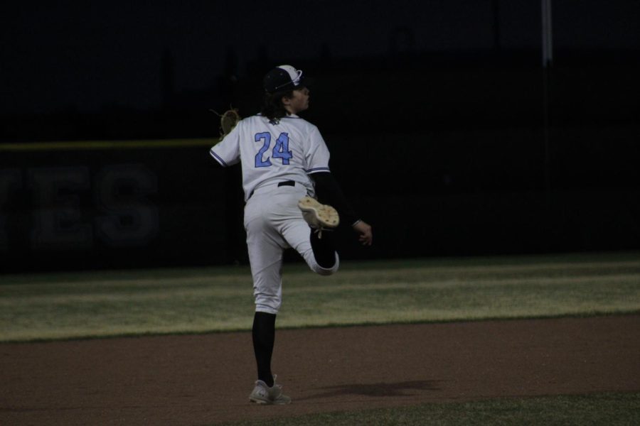 Sophomore, Bodie Sellmeyer, mid throw to first while warming up. Bodie was playing third base against the Thunderbirds.