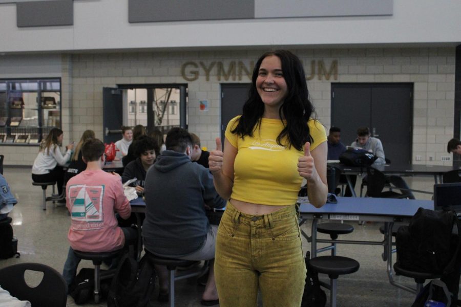 Hudgins gives two thumbs up for her bright yellow outfit for monochromatic day. 