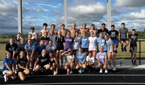 The Wolves cross country team posing for a photo after one of their last workouts of the summer training season. 