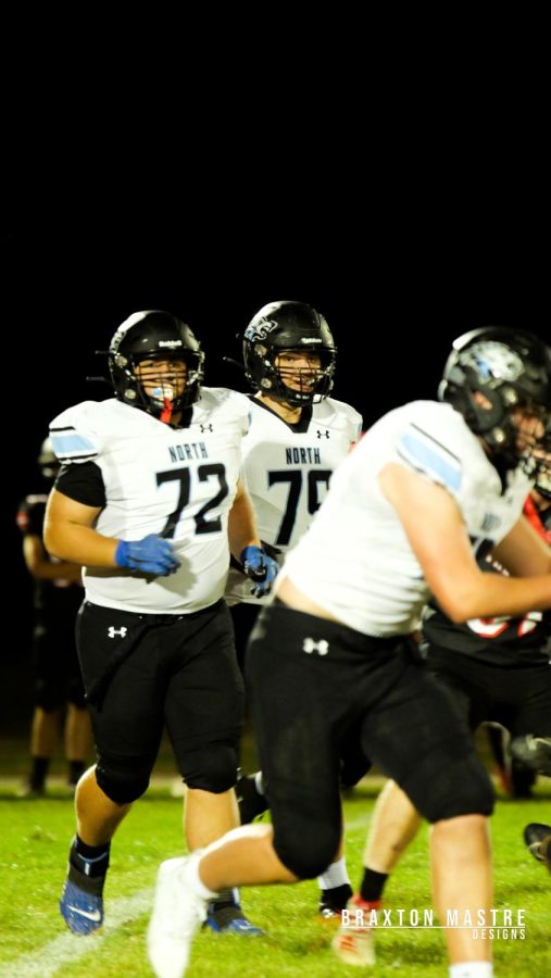 Sophomore Ben Madrigal (72) looking to break through the offensive line in the Elkhorn North Vs Mount Michael game.