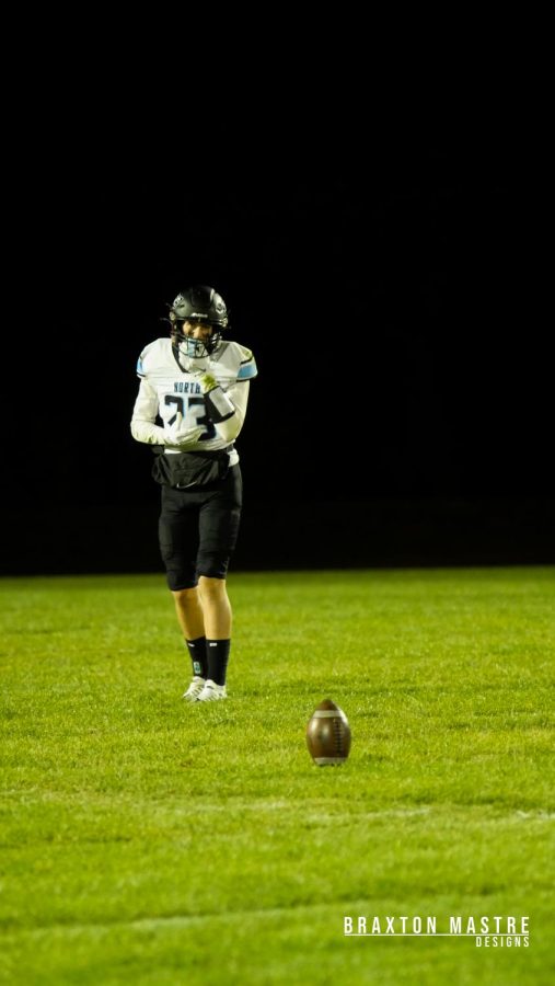 Sophomore Chase Loften (23) preparing to punt the ball in the Elkhorn North Vs Mount Michael game.