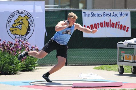 Junior, Sam Thomas, throwing shot put at the state track meet. Every year state track is hosted at Burke High School in May, and during the 2022 field events it was quite warm. Photo Courtesy of Sam Thomas. 