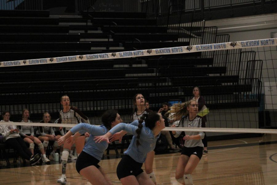 Junior middle blocker DelaneyBriganti and Meyer are loading up to block an outside attack from the Vikings.  As the two in the front row block, the rest of the team gets ready in a defensive position in order to dig the ball.  