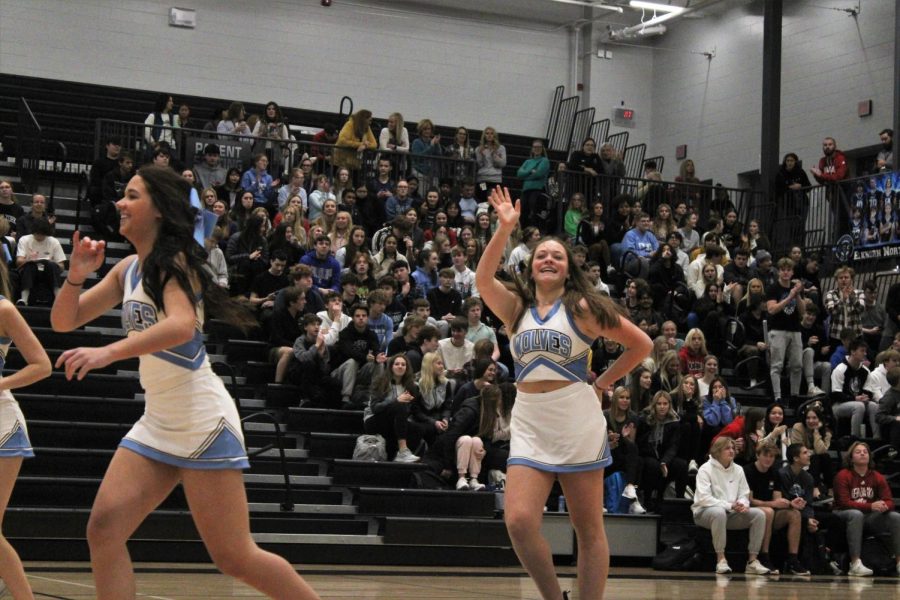 Loghan Evert waves and smiles at the students while running off the gym floor after finishing their dance routine. The dance team gave an amazing performance for the students and staff at the winter pep rally.