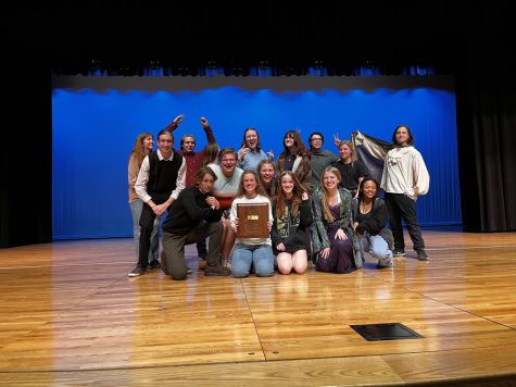 The One Act team holding their Conference plaque on the Elkhorn North stage. 