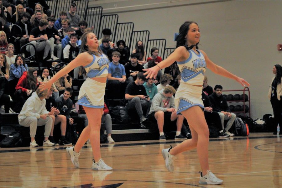 Karlie Efaw (front) and Loghan Evert (back) are showing off their dance at the pep rally. Both are focused on their routine.