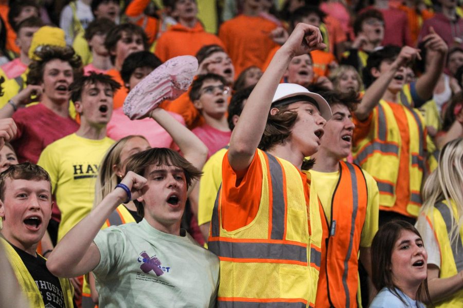 Seniors Levi Larson and Garrett Heaney cheer for the girls as the rest of the student section are excitedly up on their feet. 