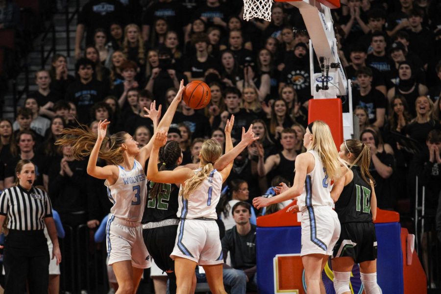 Senior forward Grace Heaney rebounds the ball during the class B girls state basketball championship game.  The girls basketball team was looking for their third straight consecutive state title.  