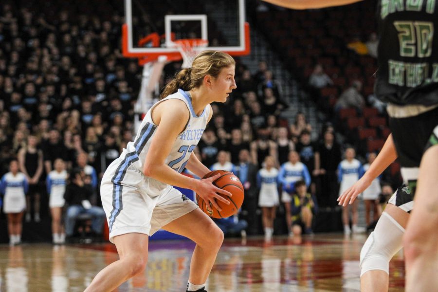 Junior shooting guard Sydney Stodden looks for an open teammate.  Stodden was guarded by the SkyHawks.