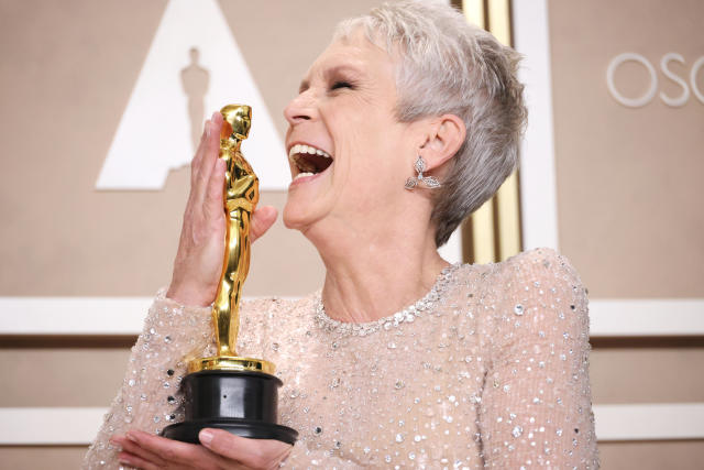 Jamie Lee Curtis poses with her Oscar after her performance in Everything Everywhere All at Once. Curtis finally wins her first Oscar after almost 50 years in the business. 