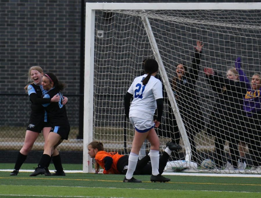 OBrein celebrates with her team after a home goal against Boystown. 