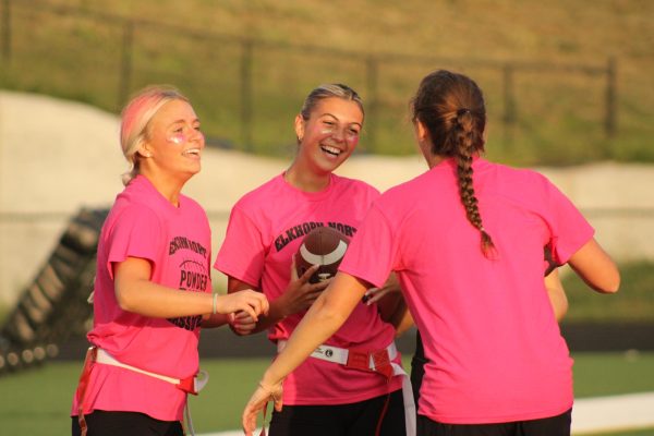 Pink team cheers after a good play. 
