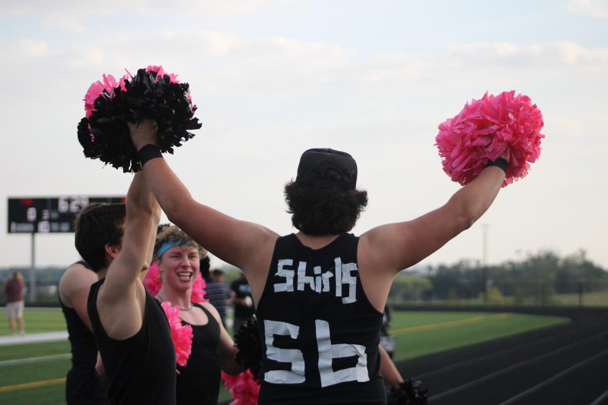 Senior Austin Shirley cheers with the other senior boys at the girls powder puff football game on Saturday 13, 2023. Austin plays on varsity football and plans on playing somewhere close to home in college. 