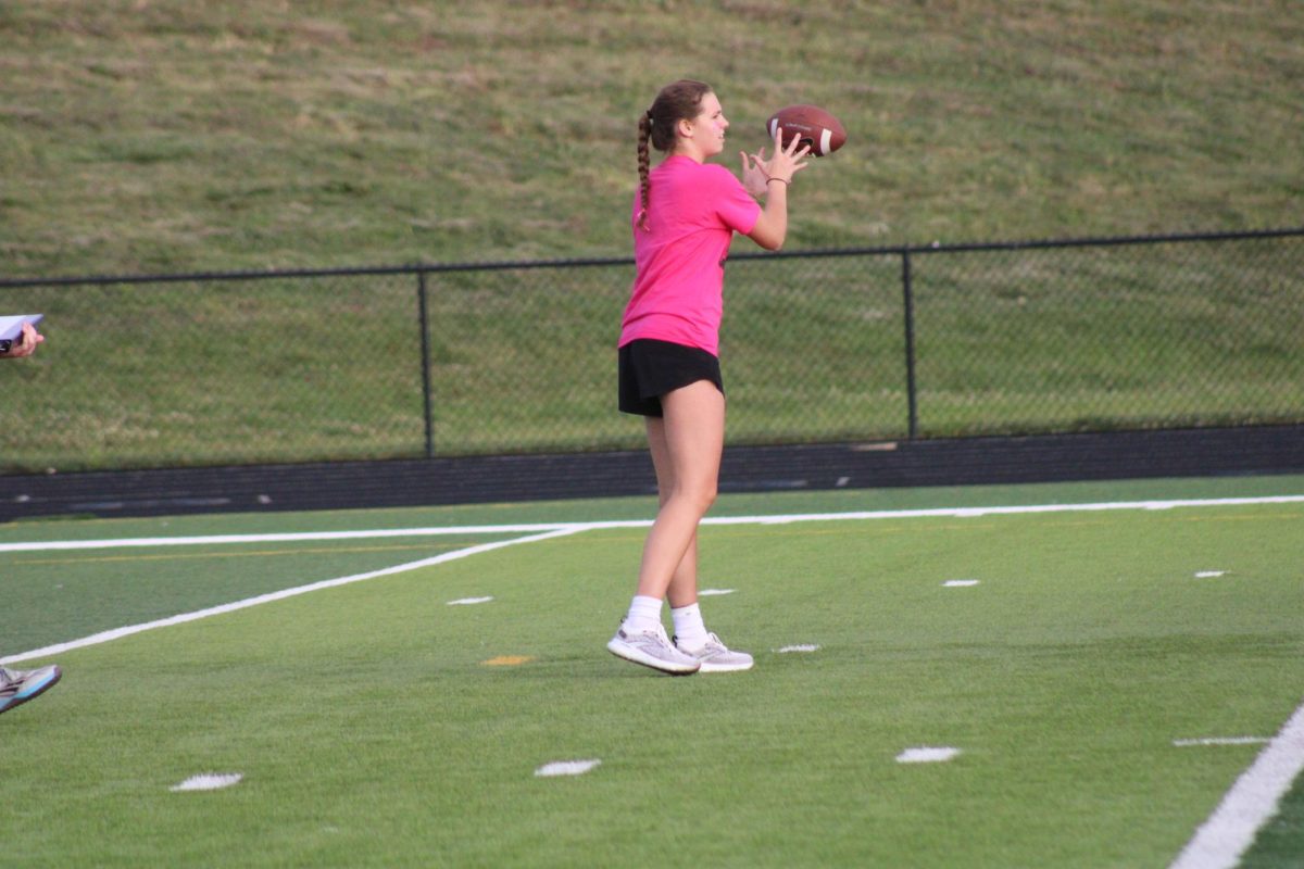 Senior Mckenna Murphy catches a pass at the powder puff game on September 13, 2023. She plays varsity basketball at Elkhorn North and plans to play in college as well. 