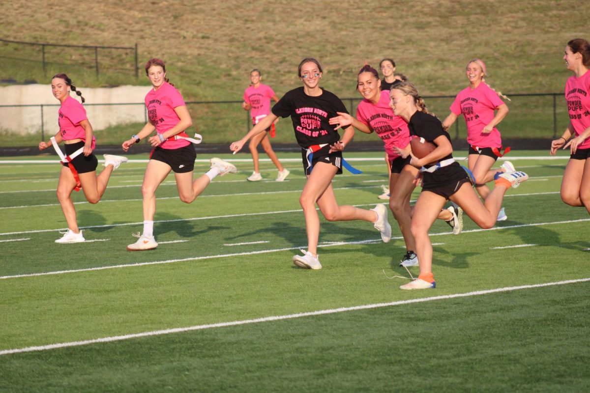 Madi Harrison runs the ball during a play in the game on September 13, 2023. She runs on varsity track at Elkhorn North Highschool. 