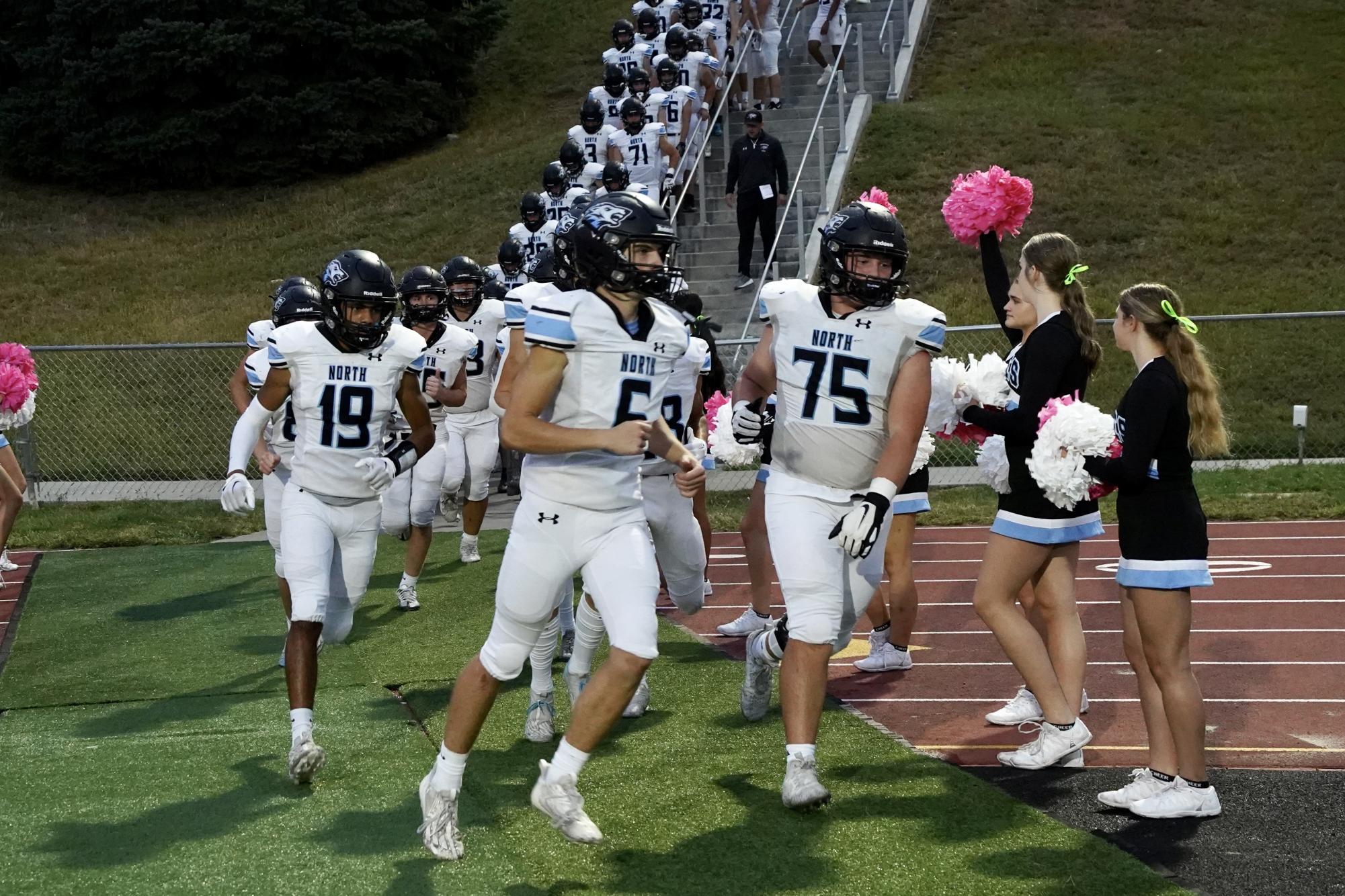 Marler (No. 75) running onto the field for the first time this season since his injury. Photo courtesy of Renee Vokt.