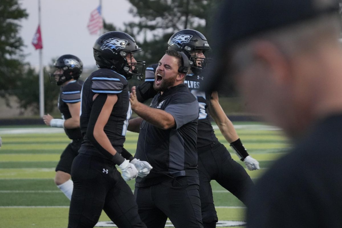 Coach Anthony Dunn pumped up after Tommy Mecknas interception. This sets up a scoring drive for the Wolves.
