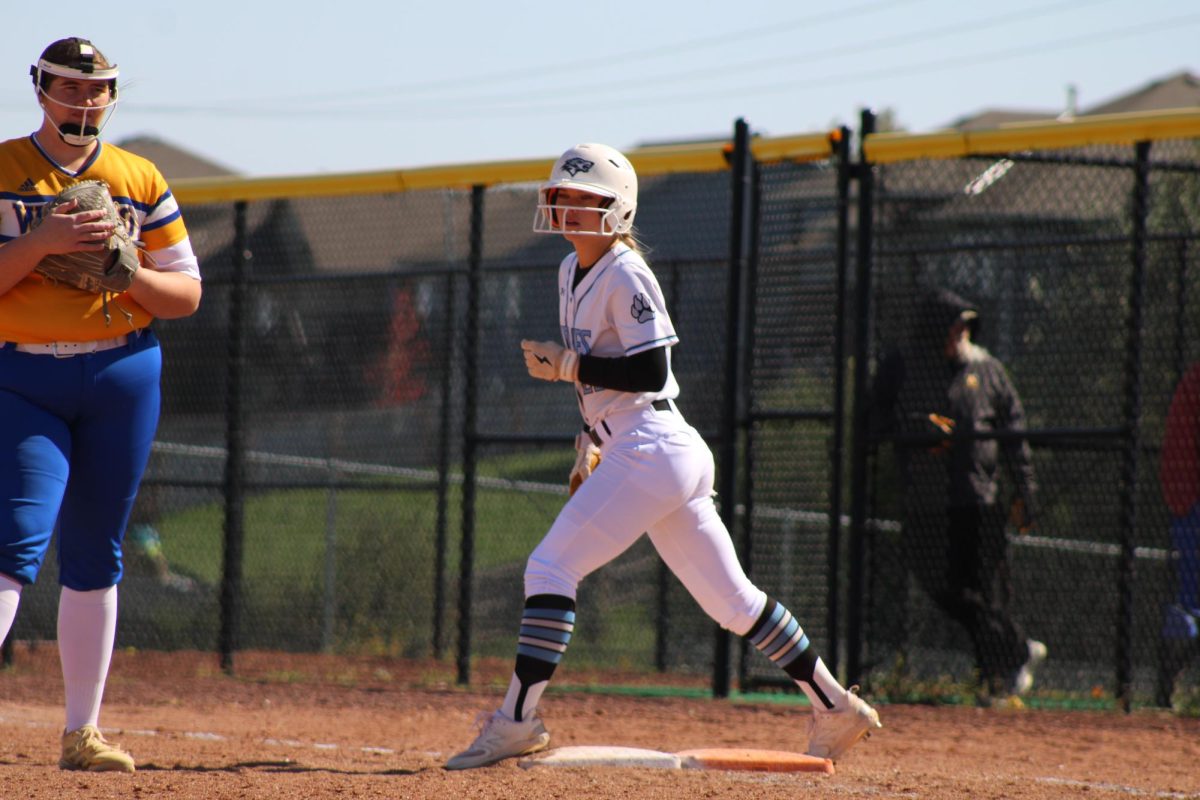 Mia Turner on first base. Turner is a freshman and runner on varsity softball. 