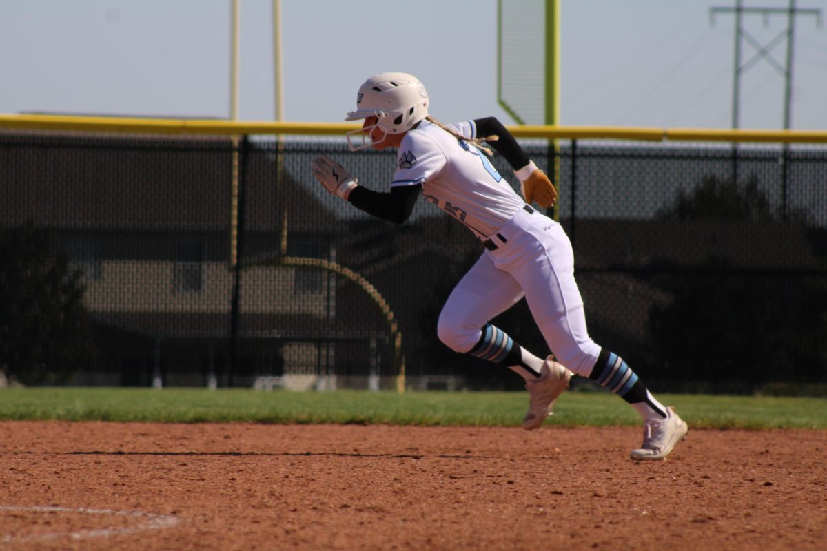 Mia Turner running to second base. Turner has a sister who is a senior on varsity softball as well. 