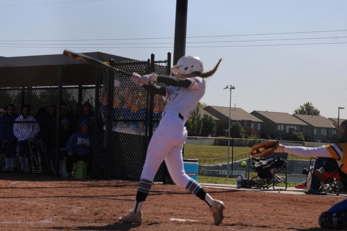 Delaney Phalen hitting the ball. Phalen is a sophomore on varsity softball and plays left field. 