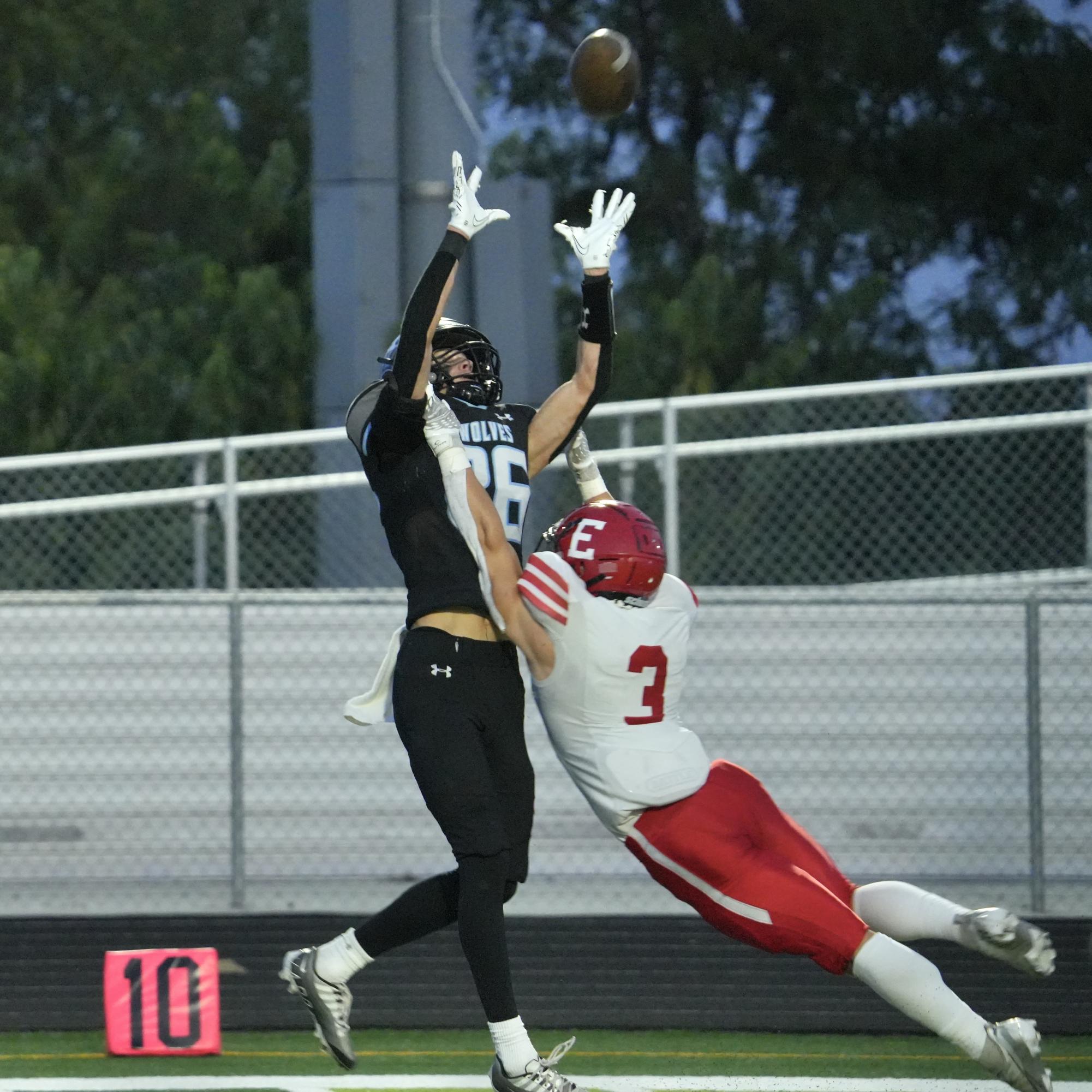 Tommy Meckna catches a deep pass. The Wolves set up inside the ten yard line and score.