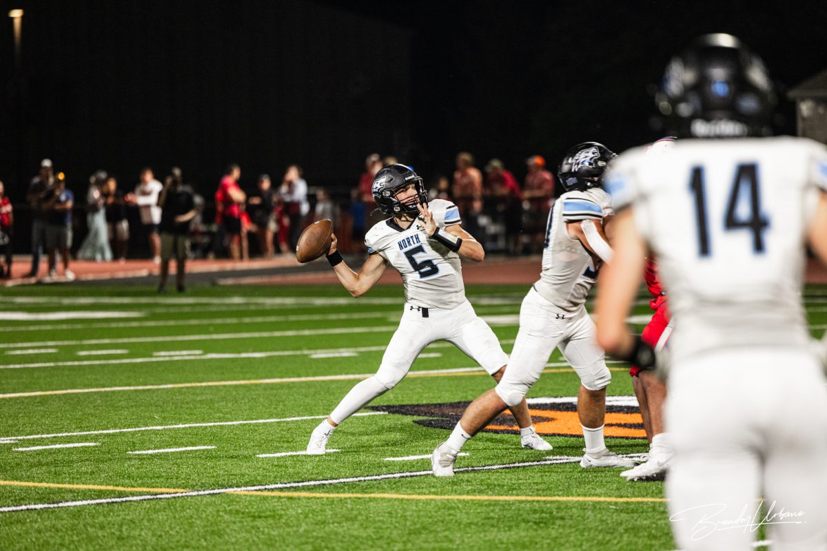 Sophomore Ethan Beachy (5) launches a deep pass agaisnt Crete on September 8th, 2023. He started as quarterbacl and led the team to a 58-6 victory.