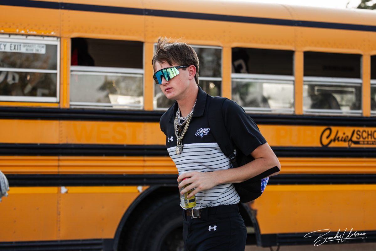Sophomore football manager Jack Settles gets off the bus before the Elkhorn North vs Elkhorn High Rivalry game on September 29th, 2023.