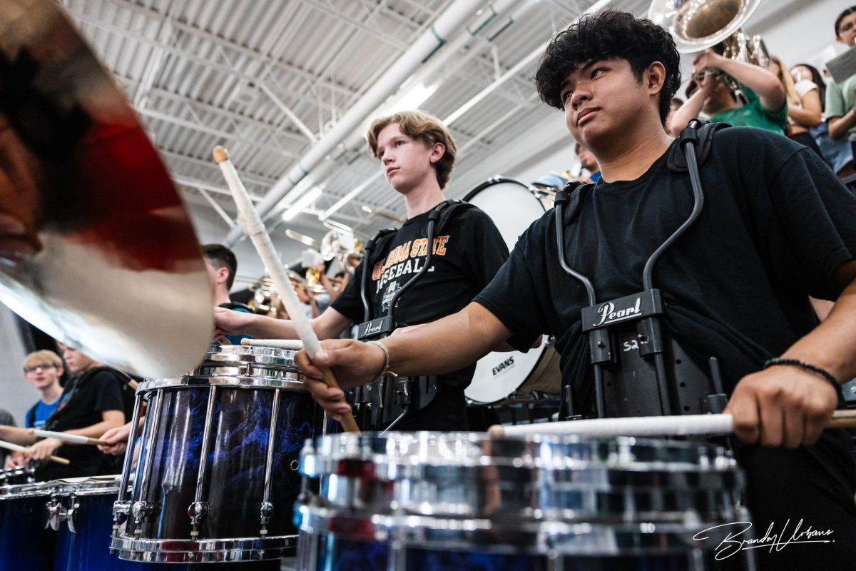 Junior Korivn Pham drumming for the Elkhorn North pep band during the fall sports pep rally on August 25th, 2023.
