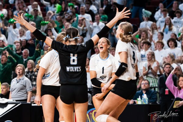 Senior Reese Booth (1) celebrates with the team after a big kill during the NSAA Class B State Volleyball Semifinals against Skutt.on November 3rd, 2023. Booth is the setter for the Wolves.