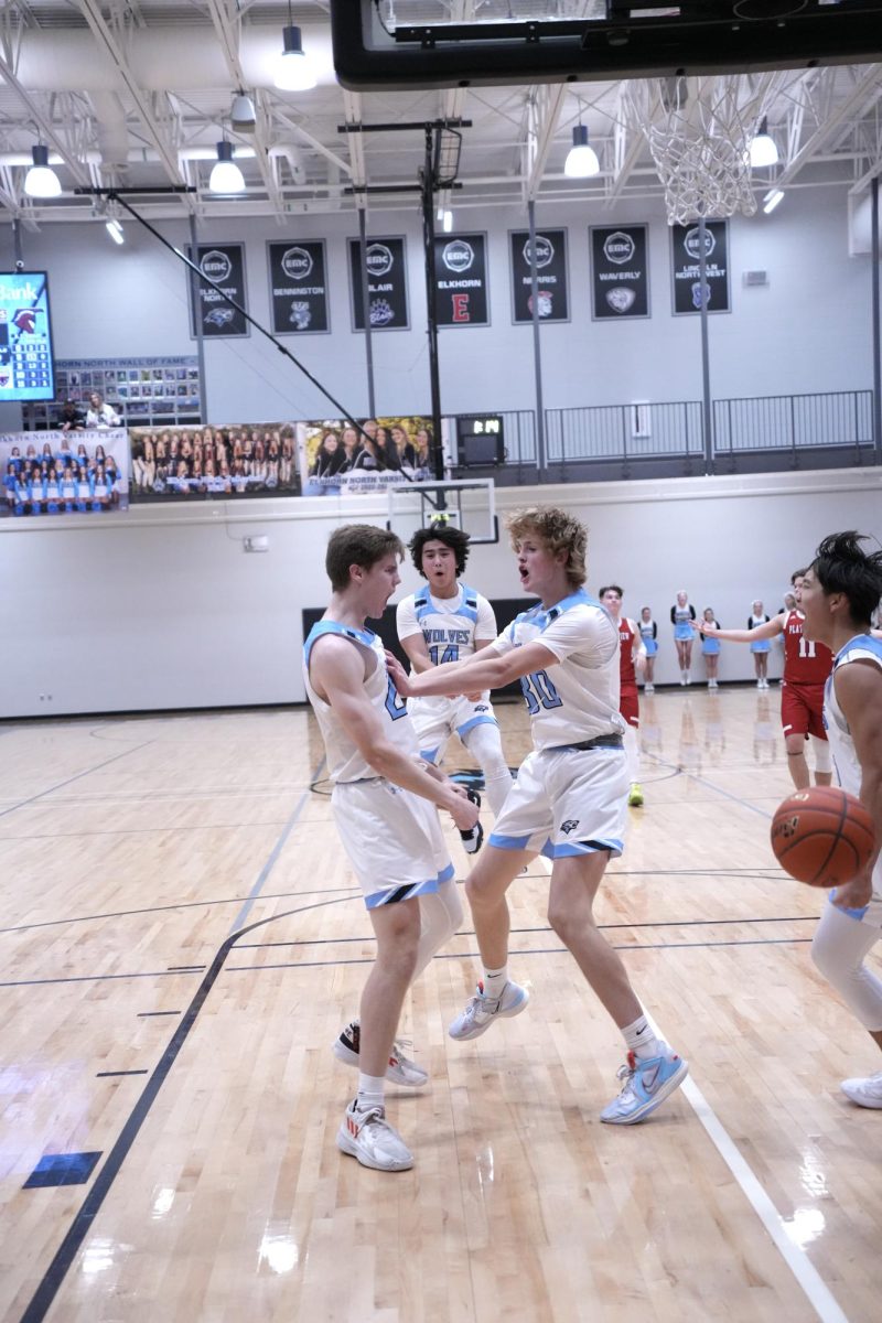 Junior Will Farrington flexing and celebrating with teammates after a tough and-1 bucket. This was at the game vs Platteview on Dec. 1, 2023 that resulted in a loss with a score of 73-62.