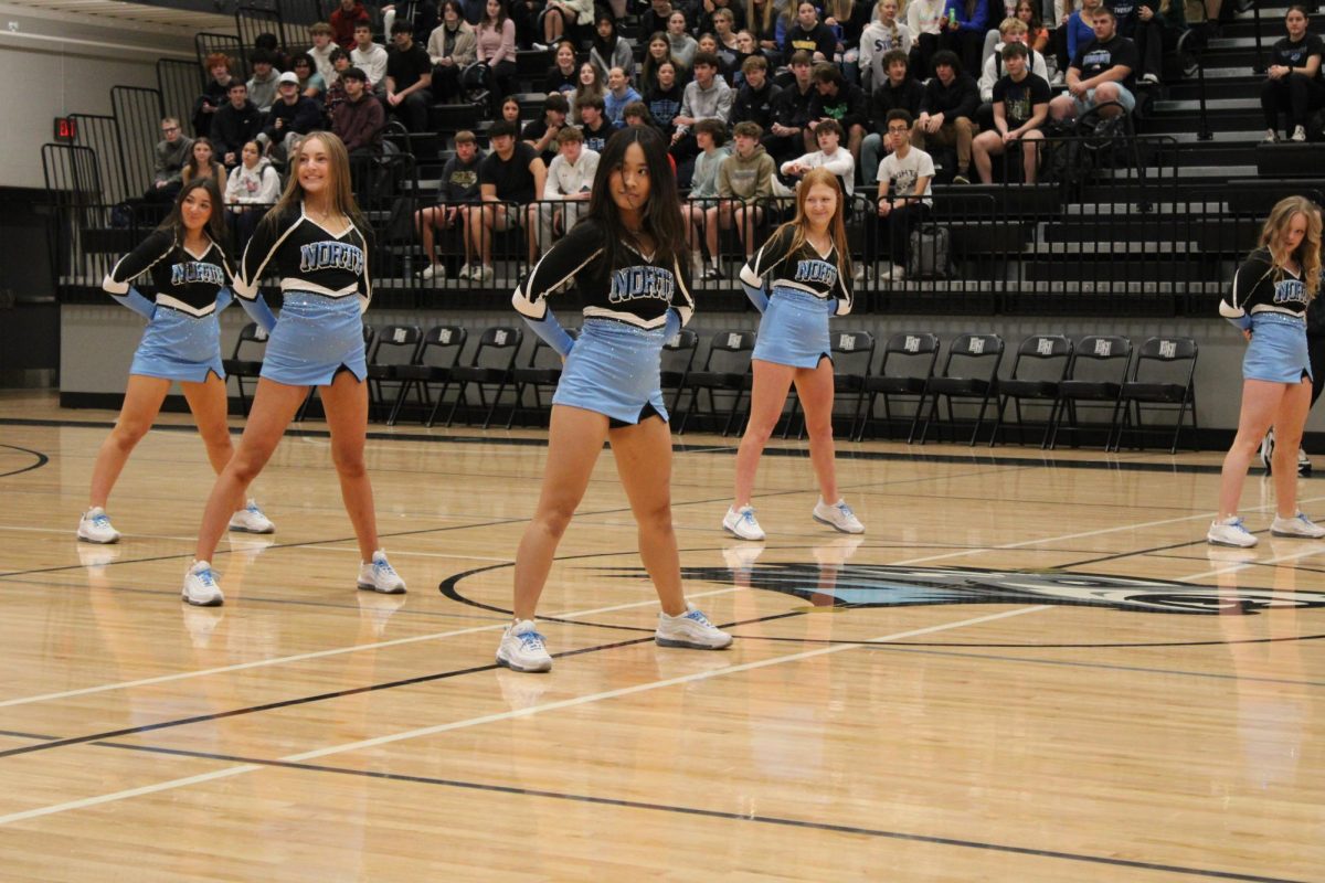 Sophomores Claire Davenport and Cosette Kaminski and freshmen Hannah Skudlarek, Ady Tuttle, and Kendal Pham face the audience. They preformed their hip-hop dance at the winter pep rally on Dec. 8th 2023.