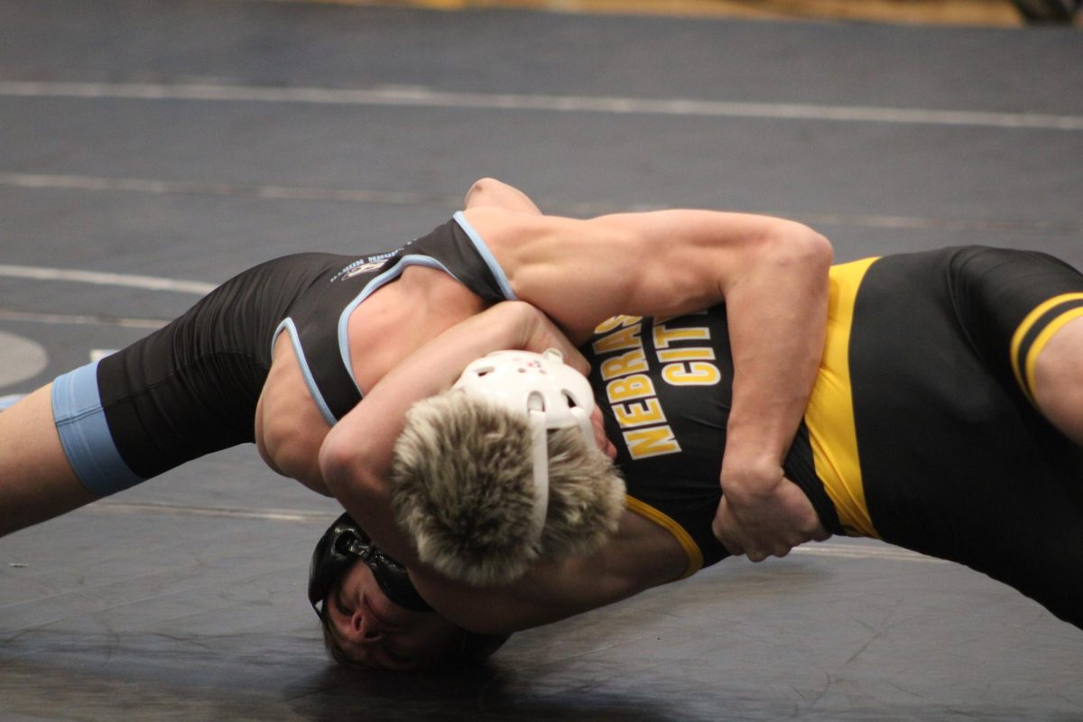 Sophomore Tyson Philbricks attempt to pin his opponent on Thursday, November 30th. He succeeded later on after almost getting pinned himself.