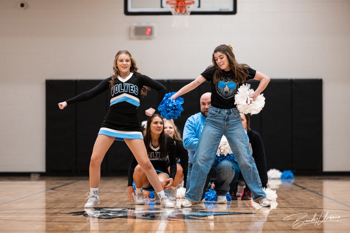 Choir teacher Casey Allen and sophomore Audra Brabec at the winter pep rally. Each teacher and cheerleader duo choreographed an eight count to preform at the winter pep rally on Dec. 8th 2023.